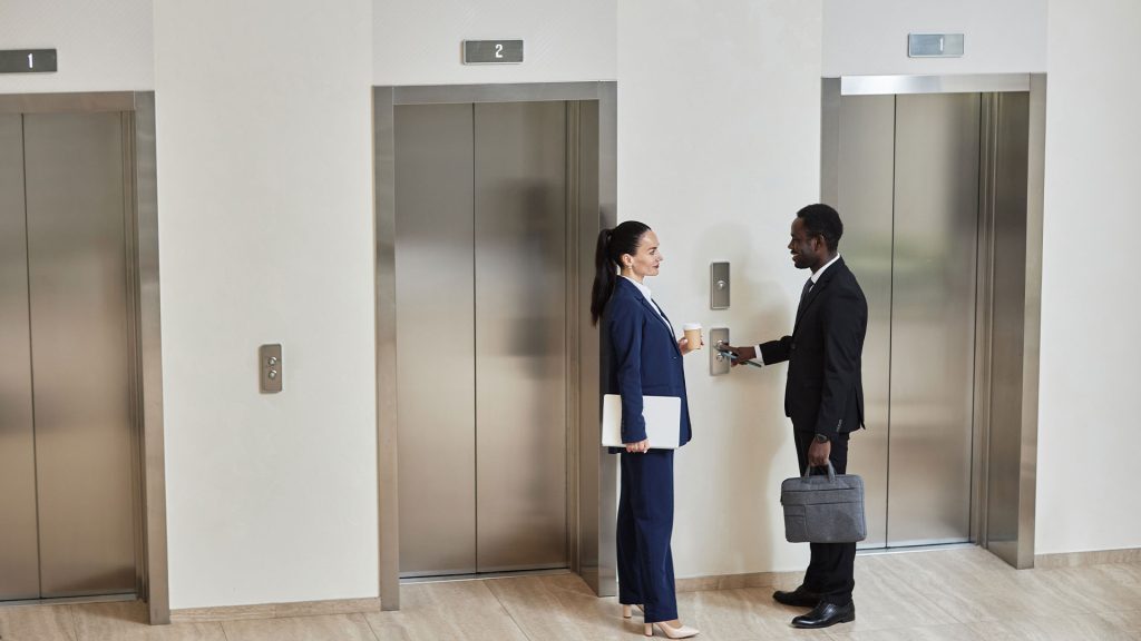 Business people waiting for the lift